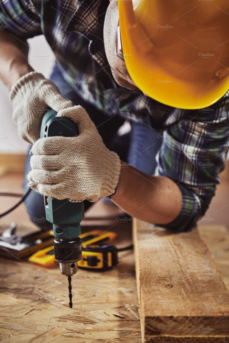 handyman with drill, an industrial photo by oneguydesigns